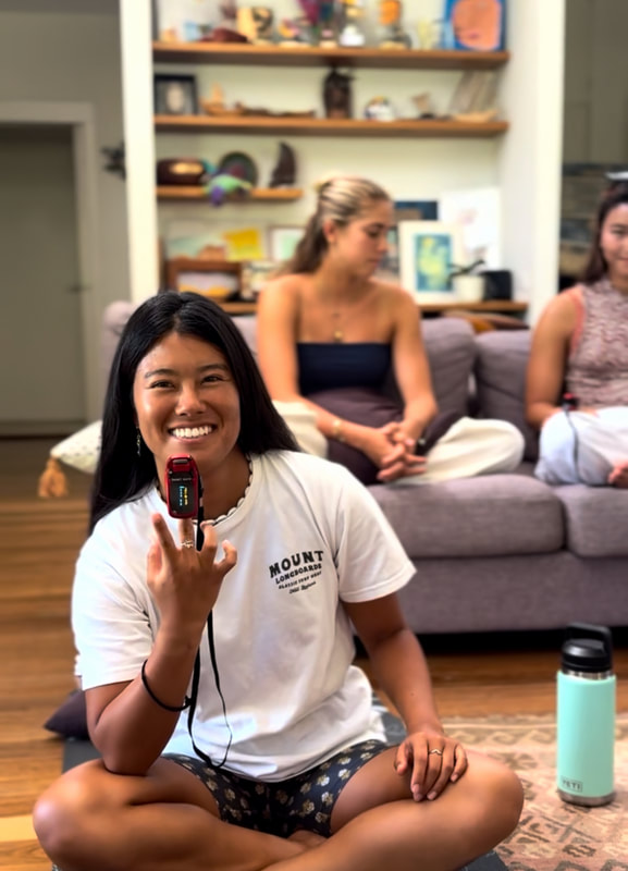 A Surf Apnea participant exploring breath and oxygen awareness during the land-based learning session
