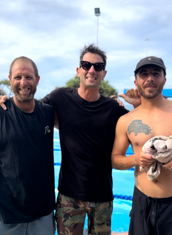 Three Surf Apnea participants together beside the pool after their workshop